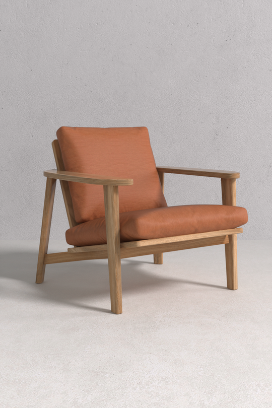 Cosimo Armchair with solid oak frame and premium fabric upholstery, handcrafted by Monarca in Colombia — timeless luxury armchair.